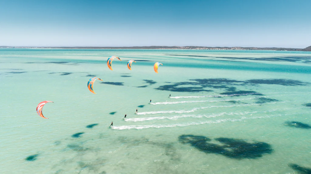 Kitesurfers over the turquoise Langebaan lagoon